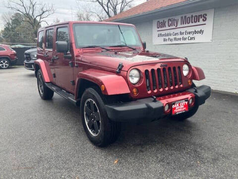 2012 Jeep Wrangler Unlimited for sale at Oak City Motors in Garner NC