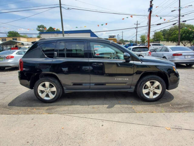 2016 Jeep Compass for sale at DAGO'S AUTO SALES LLC in Dalton, GA