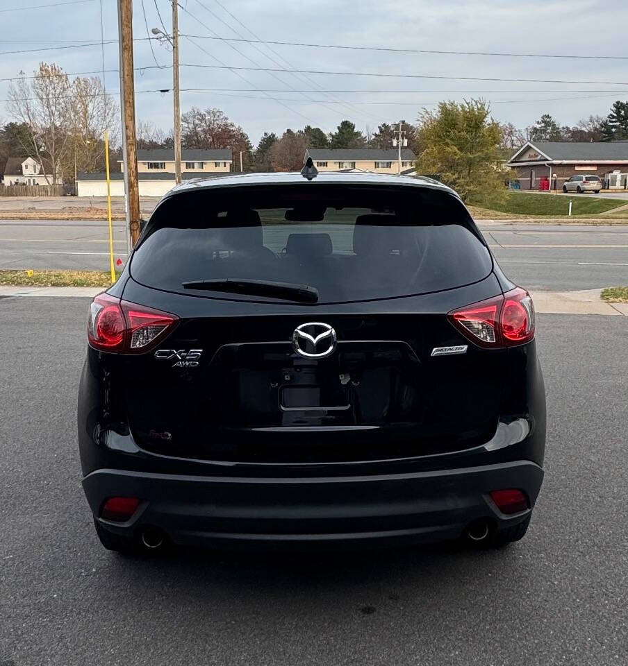 2015 Mazda CX-5 for sale at SIGNATURE AUTOS LLC in Weston, WI