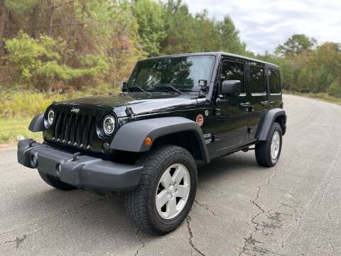 2013 Jeep Wrangler Unlimited for sale at Carrera AutoHaus Inc in Clayton NC