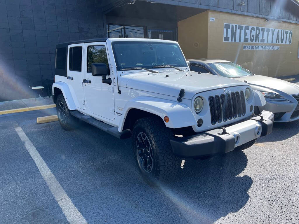 2012 Jeep Wrangler Unlimited for sale at INTEGRITY AUTO in Dothan, AL