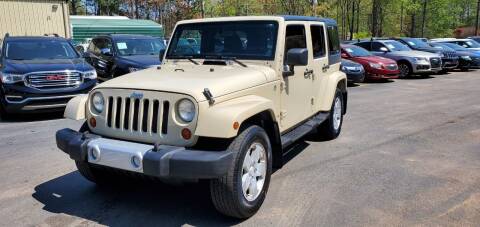2011 Jeep Wrangler Unlimited for sale at GEORGIA AUTO DEALER LLC in Buford GA
