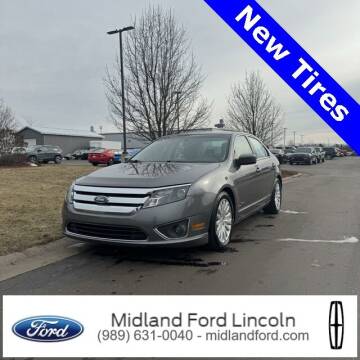 2010 Ford Fusion Hybrid for sale at MIDLAND CREDIT REPAIR in Midland MI