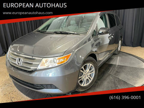 2013 Honda Odyssey for sale at EUROPEAN AUTOHAUS in Holland MI