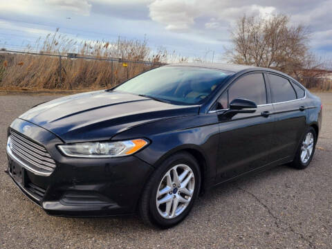 2014 Ford Fusion for sale at BELOW BOOK AUTO SALES in Idaho Falls ID