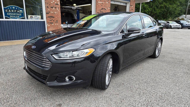 2014 Ford Fusion for sale at North Ridge Auto Center LLC in Madison, OH