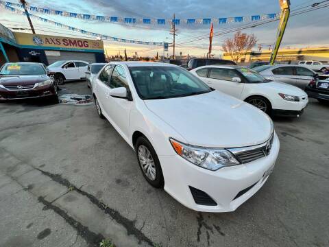 2012 Toyota Camry for sale at ROMO'S AUTO SALES in Los Angeles CA