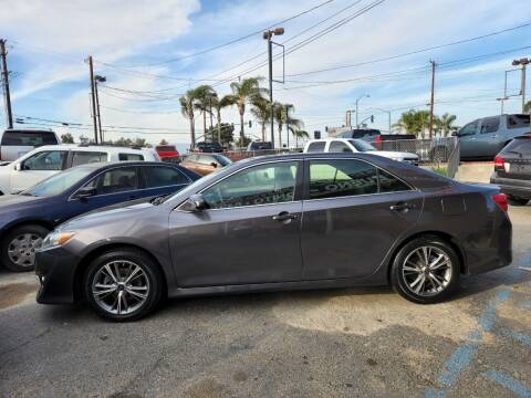 2014 Toyota Camry for sale at E and M Auto Sales in Bloomington CA