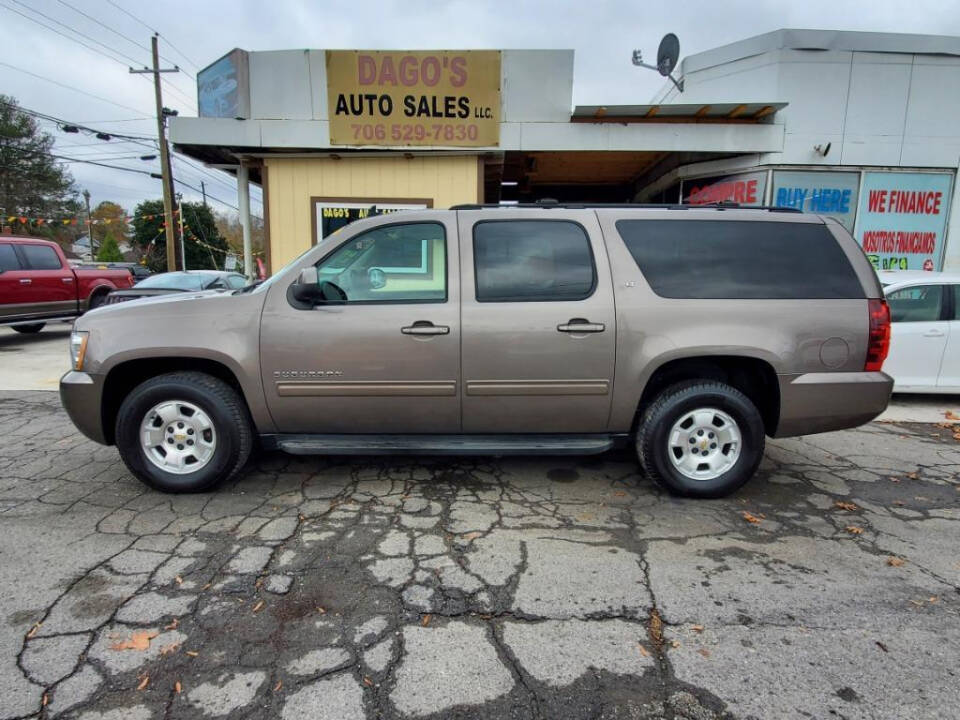 2013 Chevrolet Suburban for sale at DAGO'S AUTO SALES LLC in Dalton, GA