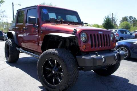2012 Jeep Wrangler Unlimited for sale at CU Carfinders in Norcross GA
