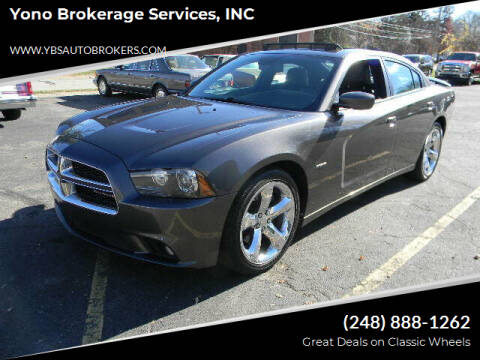2013 Dodge Charger for sale at Farmington's Finest Used Autos - Yono Brokerage Services, INC in Farmington MI