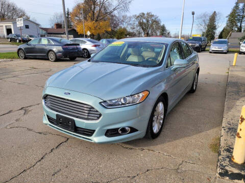 2013 Ford Fusion Hybrid for sale at Clare Auto Sales, Inc. in Clare MI