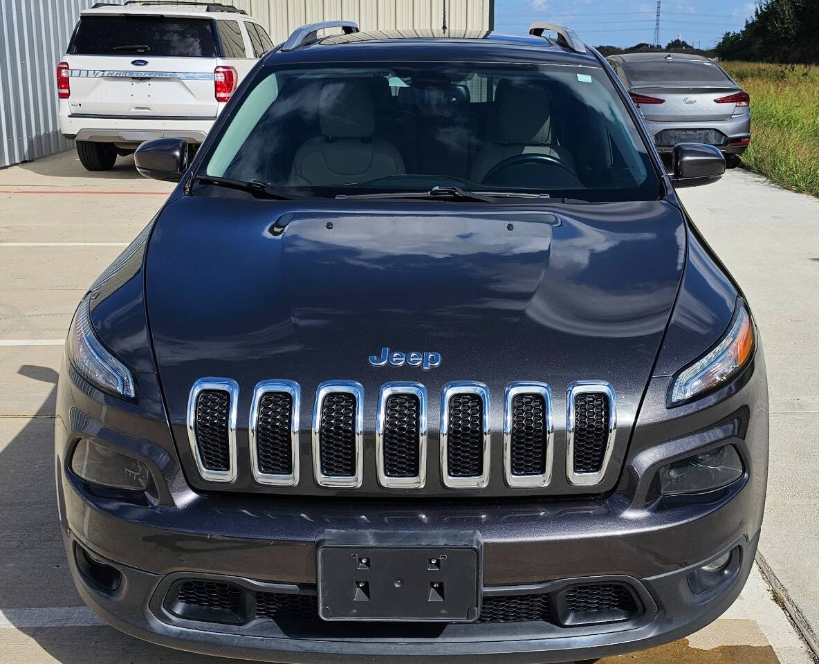 2017 Jeep Cherokee for sale at CAR MARKET AUTO GROUP in Sugar Land, TX