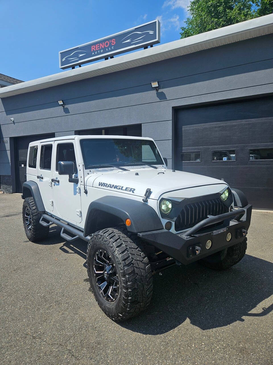 2016 Jeep Wrangler Unlimited for sale at RENOS AUTO SALES LLC in Waterbury, CT