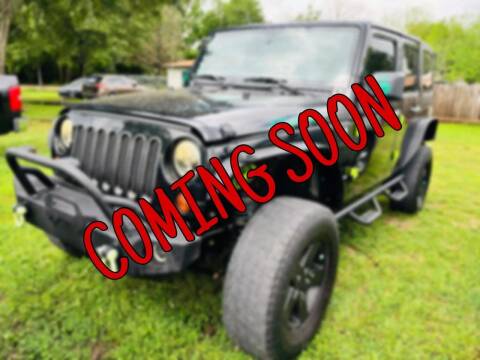 2012 Jeep Wrangler Unlimited for sale at CE Auto Sales in Baytown TX