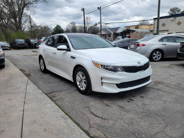 2016 Kia Optima for sale at DAGO'S AUTO SALES LLC in Dalton, GA