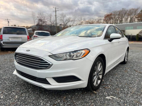 2018 Ford Fusion for sale at MGM Auto Group in Framingham MA