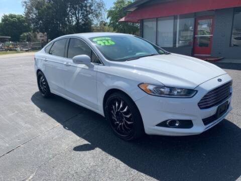 2014 Ford Fusion for sale at Used Car Factory Sales & Service in Port Charlotte FL