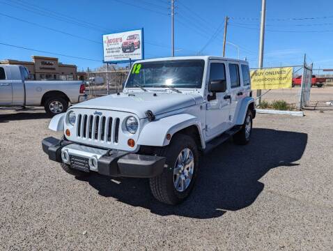 2012 Jeep Wrangler Unlimited for sale at AUGE'S SALES AND SERVICE in Belen NM