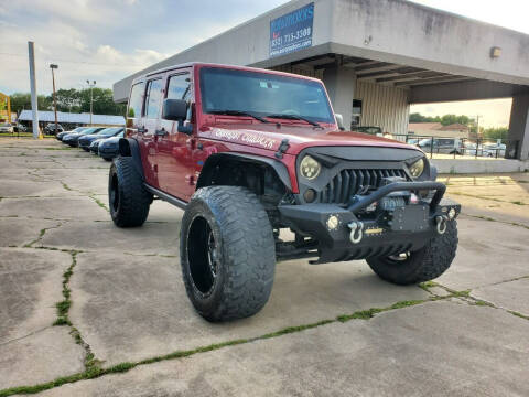 2011 Jeep Wrangler Unlimited for sale at ZORA MOTORS in Rosenberg TX