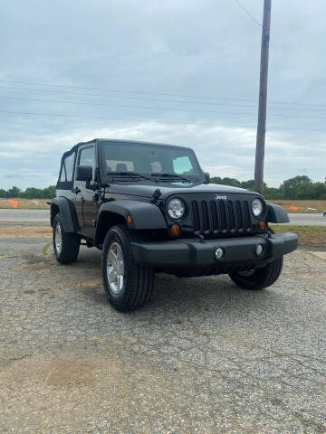 2012 Jeep Wrangler for sale at Super Sports & Imports Concord in Concord NC