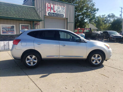 2012 Nissan Rogue for sale at H & L AUTO SALES LLC in Wyoming MI