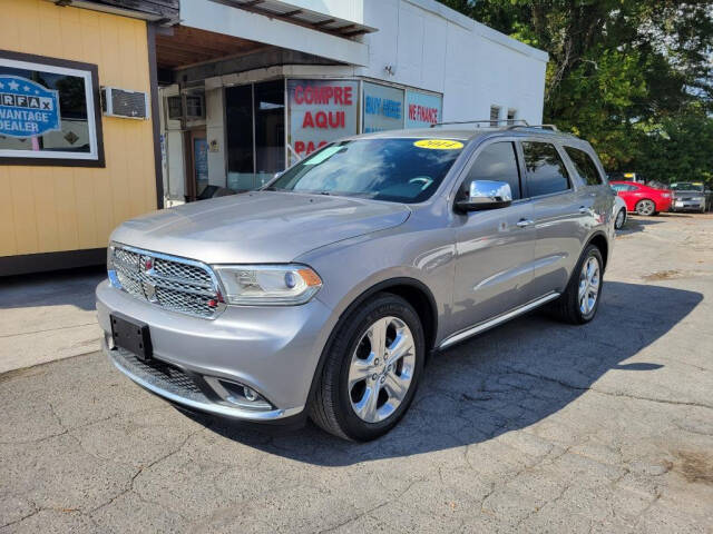 2014 Dodge Durango for sale at DAGO'S AUTO SALES LLC in Dalton, GA