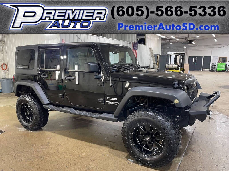 2011 Jeep Wrangler Unlimited for sale at Premier Auto in Sioux Falls SD