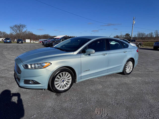 2014 Ford Fusion Hybrid for sale at Riverside Motors in Glenfield, NY