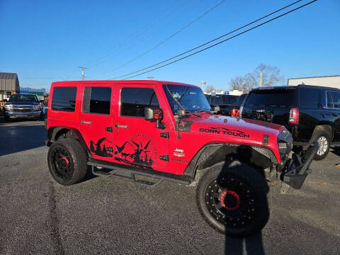 2013 Jeep Wrangler Unlimited for sale at CarTime in Rogers AR