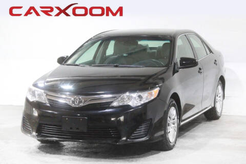 2014 Toyota Camry for sale at CARXOOM in Marietta GA