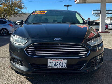 2014 Ford Fusion Hybrid for sale at Best Buy Auto Sales in Hesperia CA