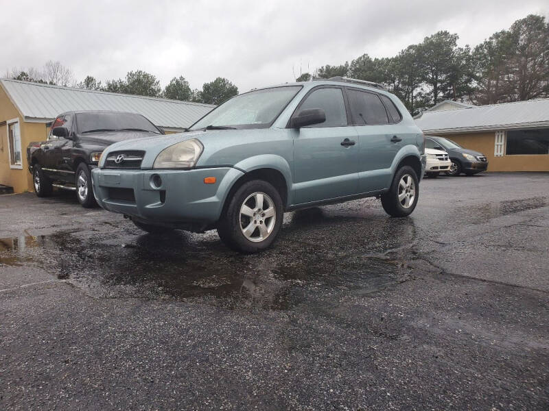 2007 Hyundai Tucson for sale at Mandingo's Automotive & Sales LLC in Snellville GA