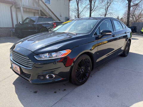 2014 Ford Fusion for sale at Azteca Auto Sales LLC in Des Moines IA