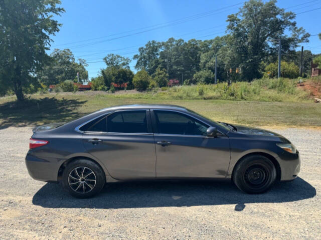 2016 Toyota Camry for sale at Guadalupe Auto Sales, LLC. in Jemison, AL