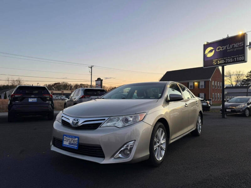 2014 Toyota Camry Hybrid for sale at CARLINES AUTO GROUP in Fredericksburg VA