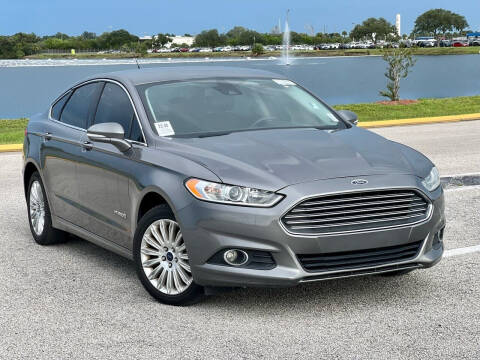 2014 Ford Fusion Hybrid for sale at EASYCAR GROUP in Orlando FL