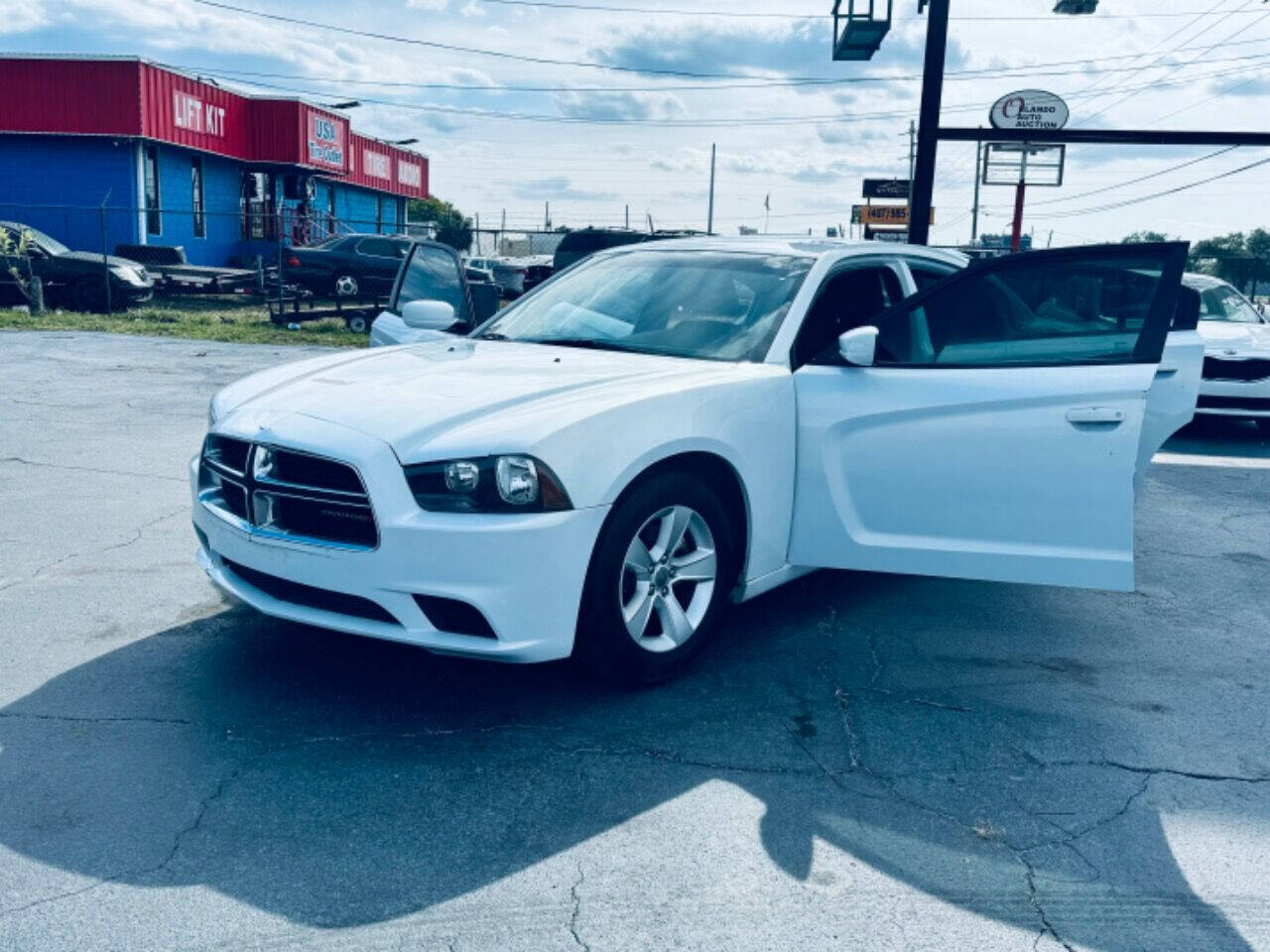 2014 Dodge Charger for sale at NOVA AUTO SALES in Orlando, FL