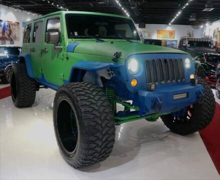 2012 Jeep Wrangler Unlimited for sale at The New Auto Toy Store in Fort Lauderdale FL