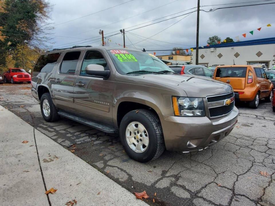 2013 Chevrolet Suburban for sale at DAGO'S AUTO SALES LLC in Dalton, GA