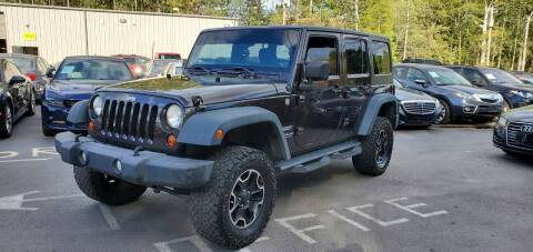2013 Jeep Wrangler Unlimited for sale at GEORGIA AUTO DEALER LLC in Buford GA