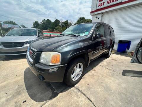 2004 GMC Envoy for sale at LAKE CITY AUTO SALES in Forest Park GA