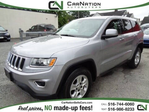 2014 Jeep Grand Cherokee for sale at CarNation AUTOBUYERS Inc. in Rockville Centre NY