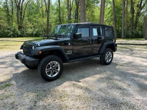 2010 Jeep Wrangler Unlimited for sale at The Car Mart in Milford IN