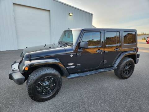 2012 Jeep Wrangler Unlimited for sale at Classic Car Deals in Cadillac MI
