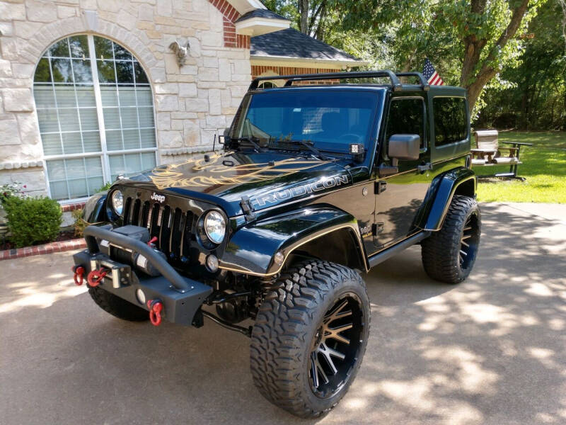2014 Jeep Wrangler for sale at Montee's Auto World Inc in Palestine TX