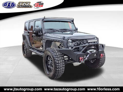 2016 Jeep Wrangler Unlimited for sale at J T Auto Group in Sanford NC