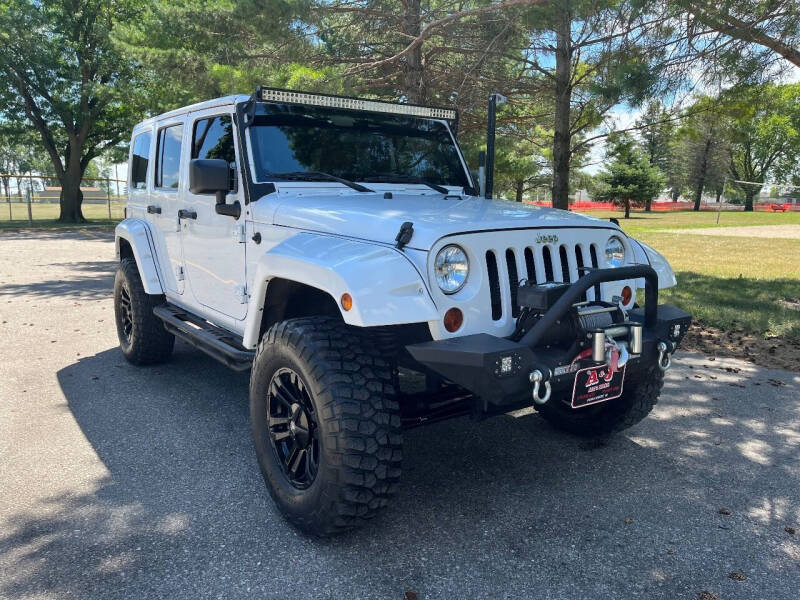 2012 Jeep Wrangler Unlimited for sale at A & J AUTO SALES in Eagle Grove IA