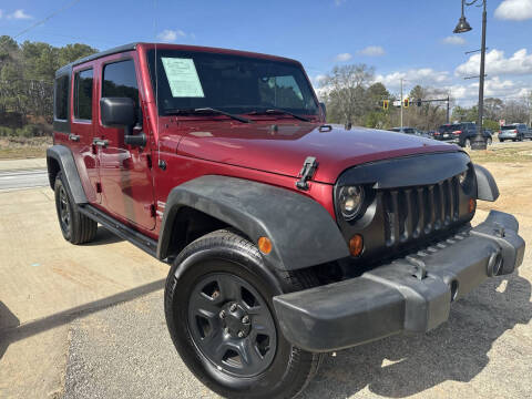 2012 Jeep Wrangler Unlimited for sale at Alpha Car Land LLC in Snellville GA