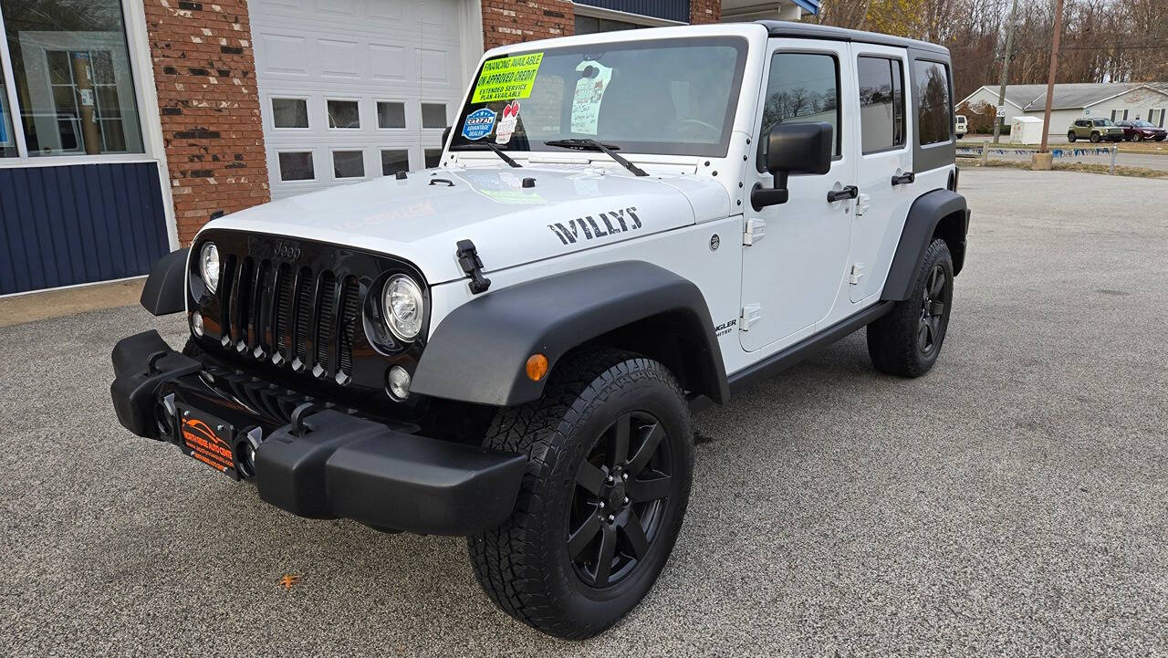 2017 Jeep Wrangler Unlimited for sale at North Ridge Auto Center LLC in Madison, OH